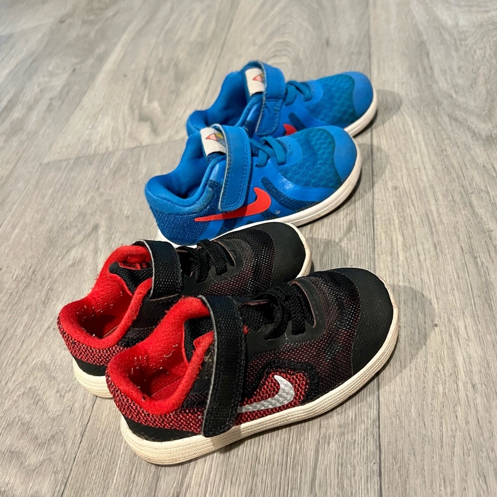 Two pairs of toddler Nike shoes